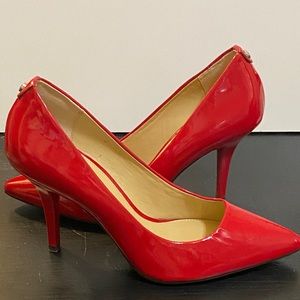 MICHAEL 
MICHAEL KORS
PATENT RED
SIZE:  81/2M
Never worn.